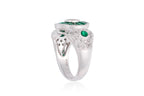 A DIAMOND AND EMERALD RING