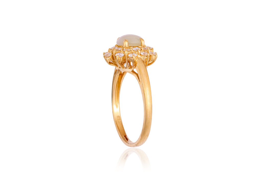 A CAT'S EYE CHRYSOBERYL AND DIAMOND RING
