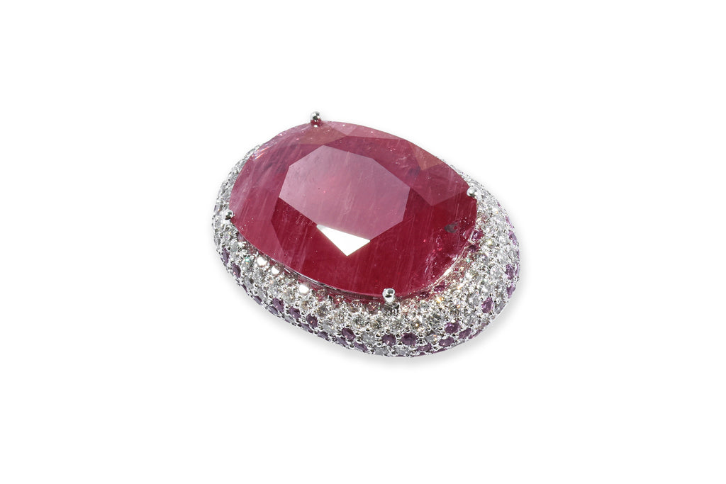 A LEAD GLASS FILLED RUBY, PINK SAPPHIRE AND DIAMOND PENDANT BROOCH