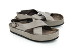 YVES SAINT LAURENT - A PAIR OF GREY LEATHER CROSS-STRAP SANDALS