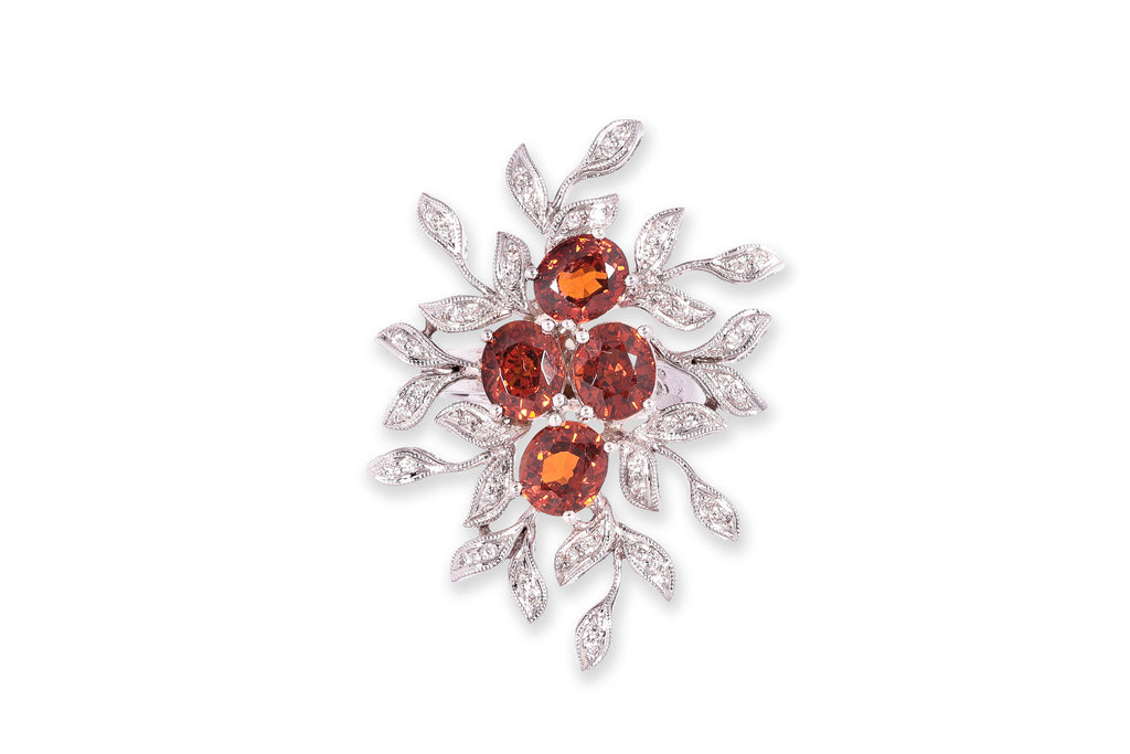 A GARNET AND DIAMOND 'BOUQUET' RING