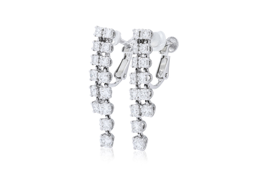 A PAIR OF DIAMOND SCREW-BACK EARRINGS BY MONNICKENDAM