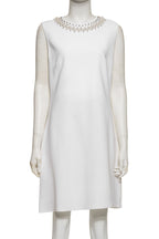GIVENCHY - A WHITE SLEEVELESS DRESS WITH FAUX PEARL EMBELLISHMENT