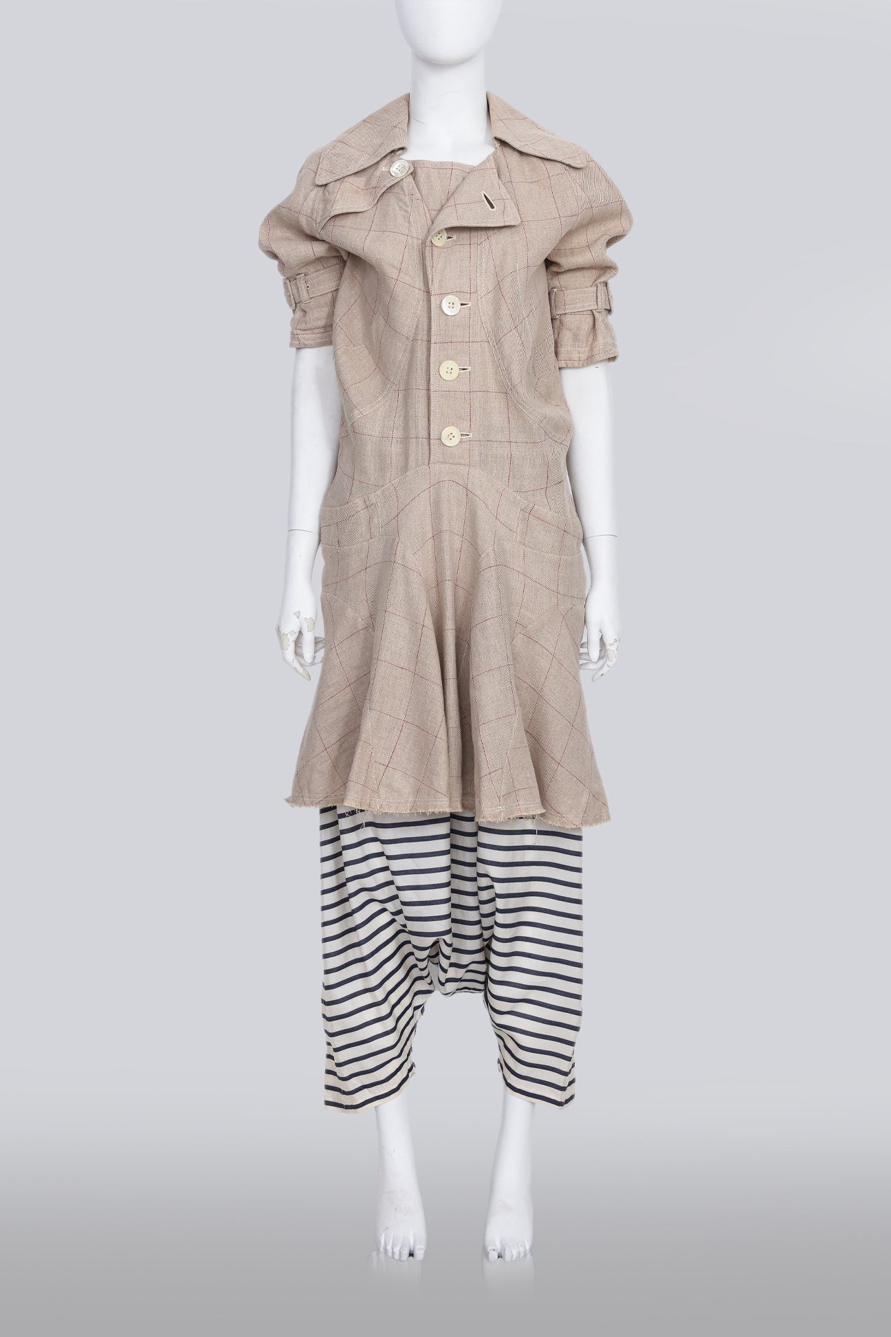 JUNYA WATANABE COMME DES GARCONS - A TAN TRENCHOAT AND STRIPED DROP CROTCH SHORTS ENSEMBLE