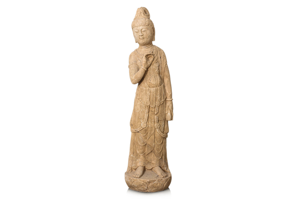 A LARGE CARVED STONE FIGURE OF A STANDING BODHISATTVA