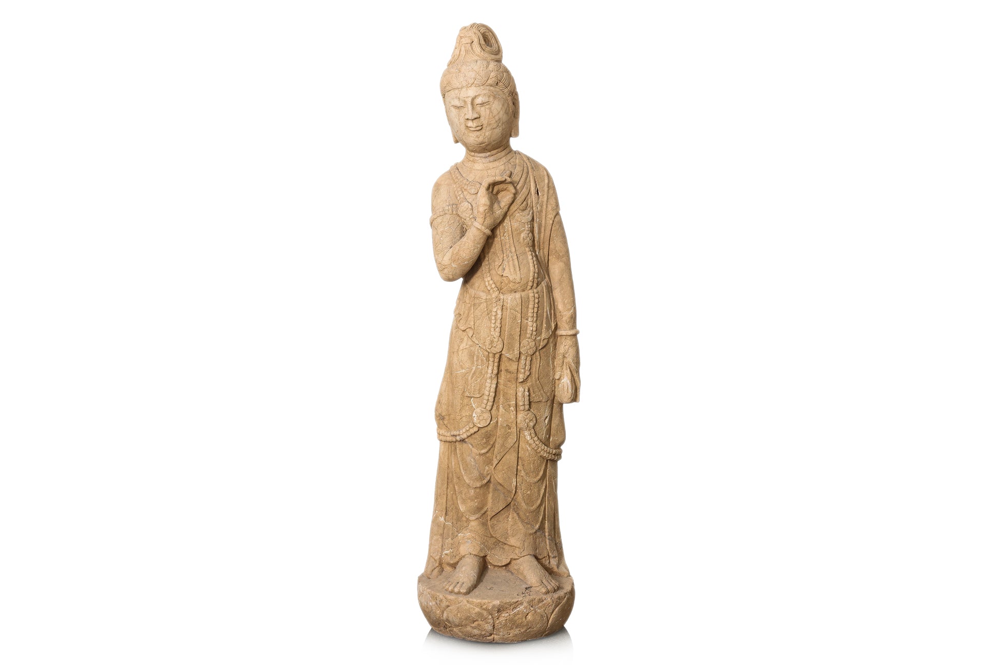 A LARGE CARVED STONE FIGURE OF A STANDING BODHISATTVA