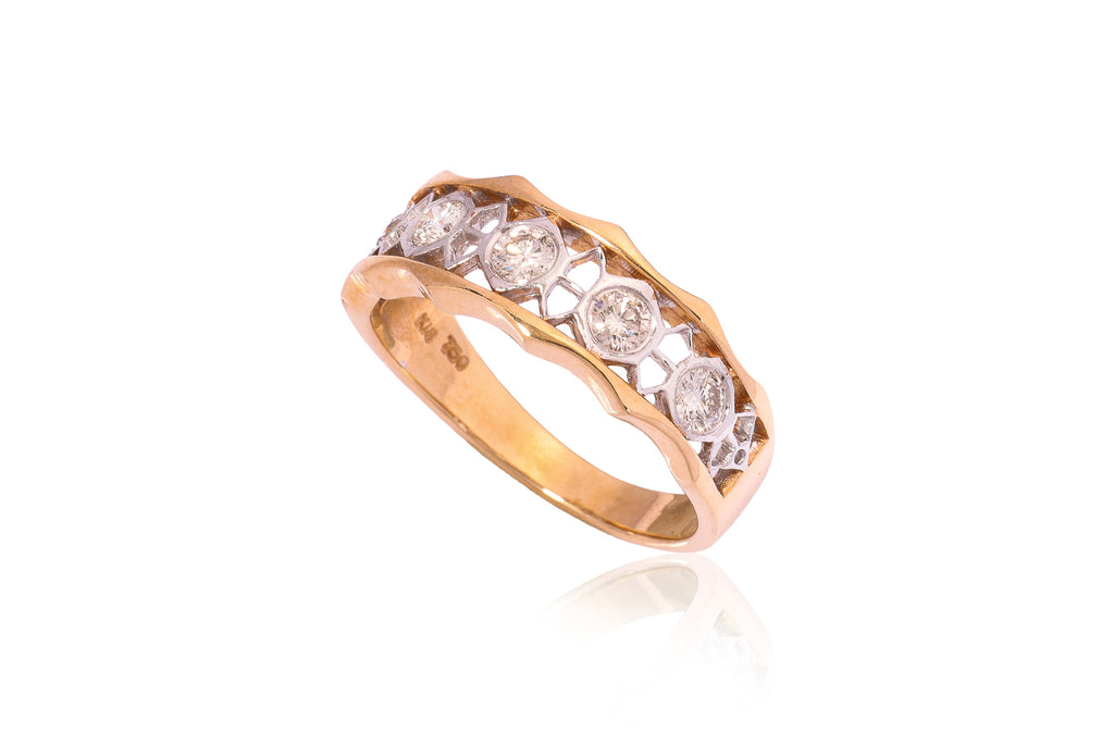 A PIERCED DIAMOND TWO TONE RING