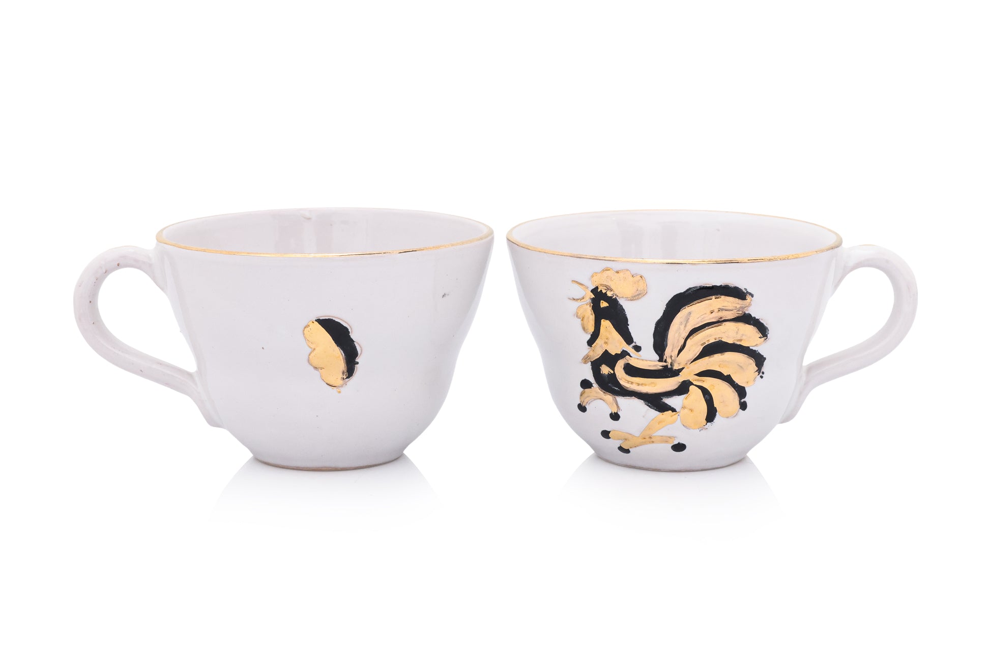 A SET OF FOUR ITALIAN CERAMIC CUPS AND SAUCERS