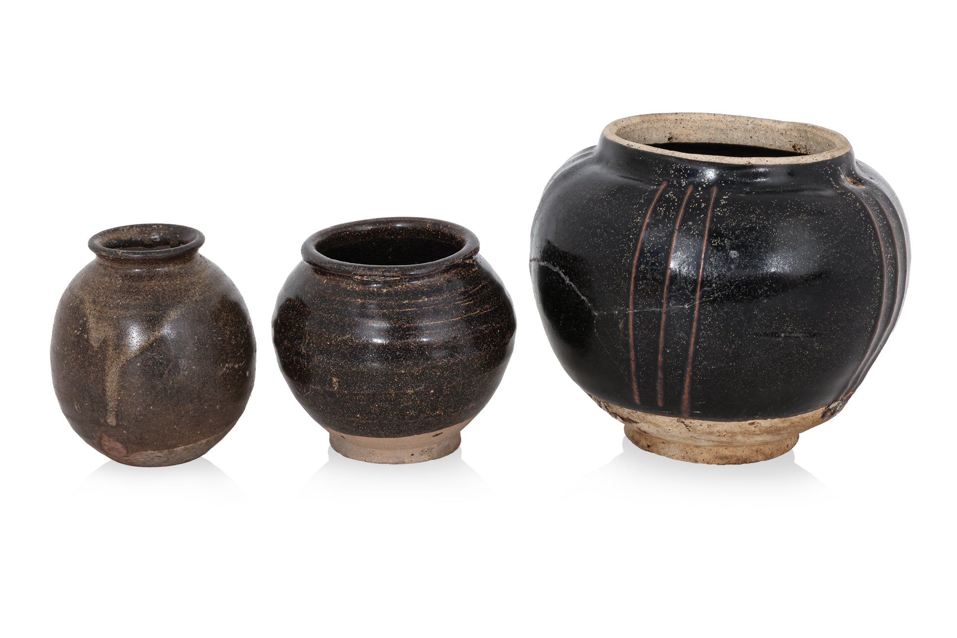 A GROUP OF THREE HENAN BLACK-GLAZED JARS