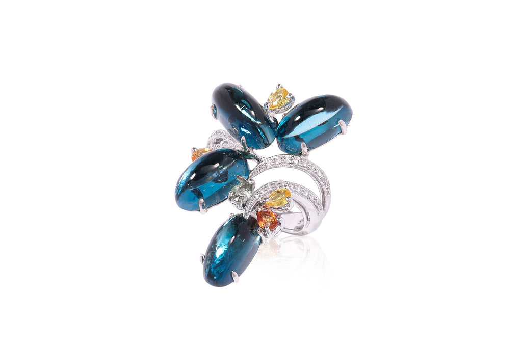 A BLUE TOPAZ, SAPPHIRE AND DIAMOND RING