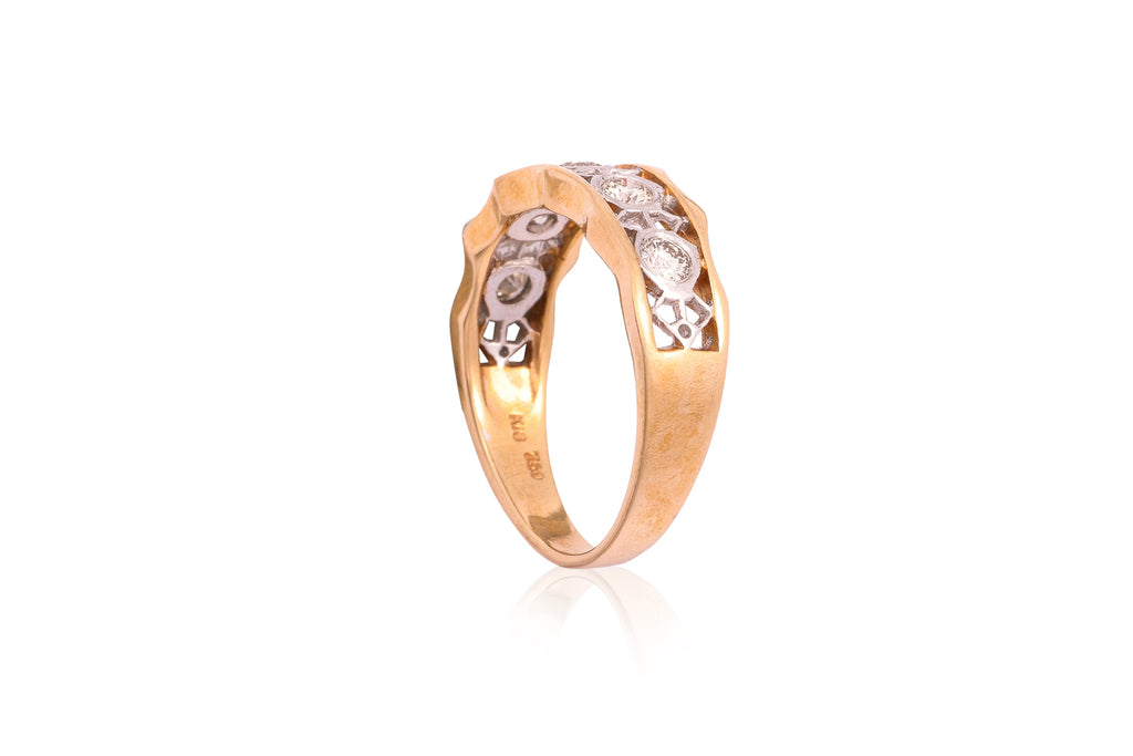 A PIERCED DIAMOND TWO TONE RING