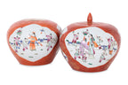 A PAIR OF CORAL GROUND FAMILLE ROSE PORCELAIN JARS
