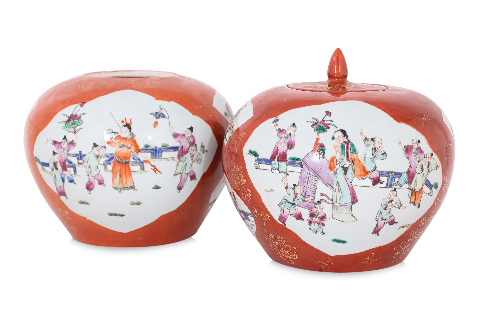 A PAIR OF CORAL GROUND FAMILLE ROSE PORCELAIN JARS