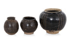 A GROUP OF THREE HENAN BLACK-GLAZED JARS