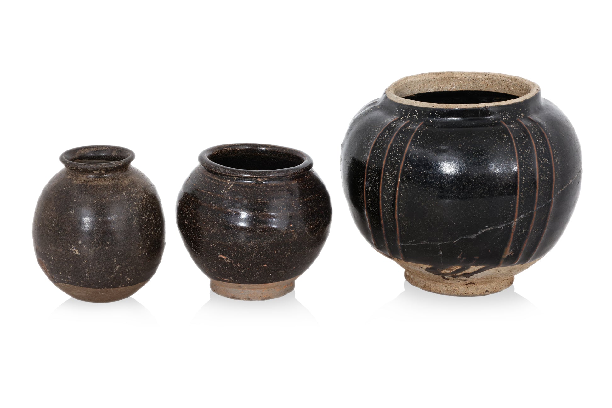 A GROUP OF THREE HENAN BLACK-GLAZED JARS