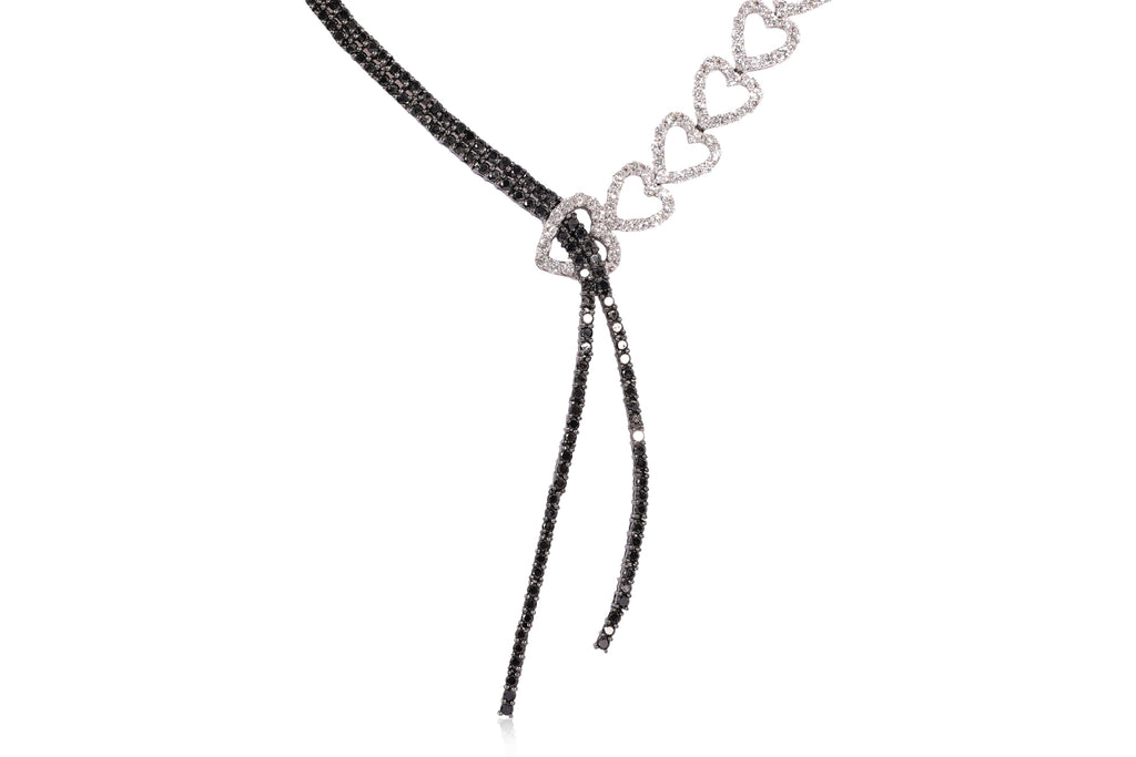 A DIAMOND AND BLACK DIAMOND TWO TONE 'RIBBON' NECKLACE