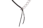 A DIAMOND AND BLACK DIAMOND TWO TONE 'RIBBON' NECKLACE