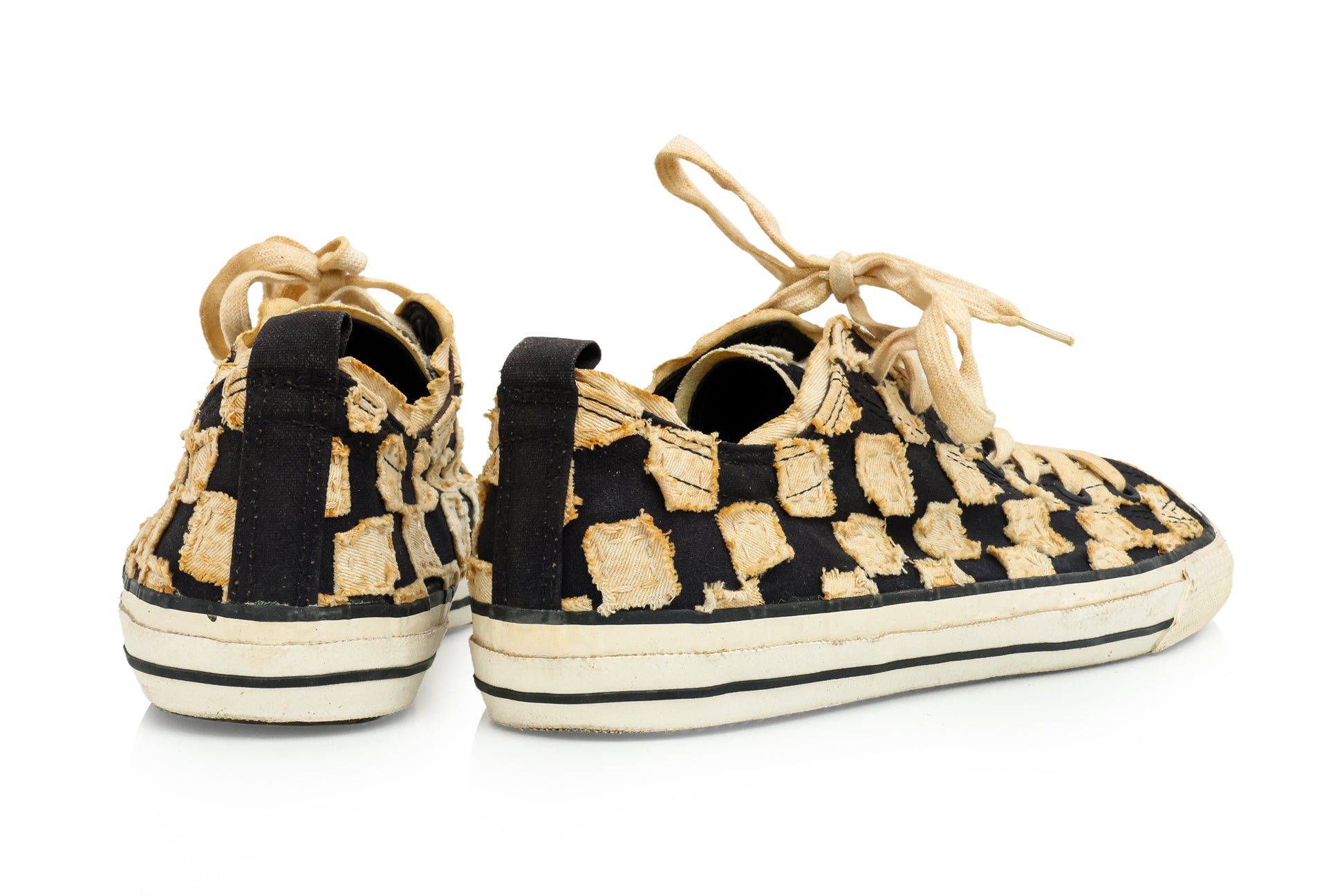 ISSEY MIYAKE - A PAIR OF BLACK AND BEIGE CHECKERED CANVAS TRAINERS