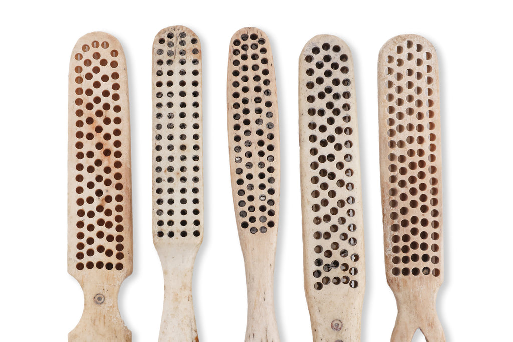A GROUP OF FIVE BONE TOOTHBRUSHES