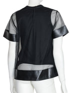 NOIR KEI NINOMIYA - A BLACK POLYESTER AND SYNTHETIC LEATHER TOP, 2017