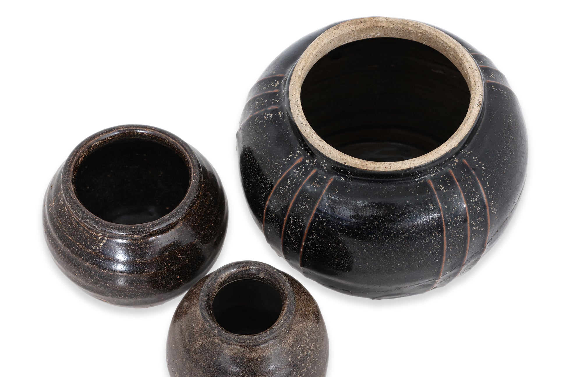 A GROUP OF THREE HENAN BLACK-GLAZED JARS