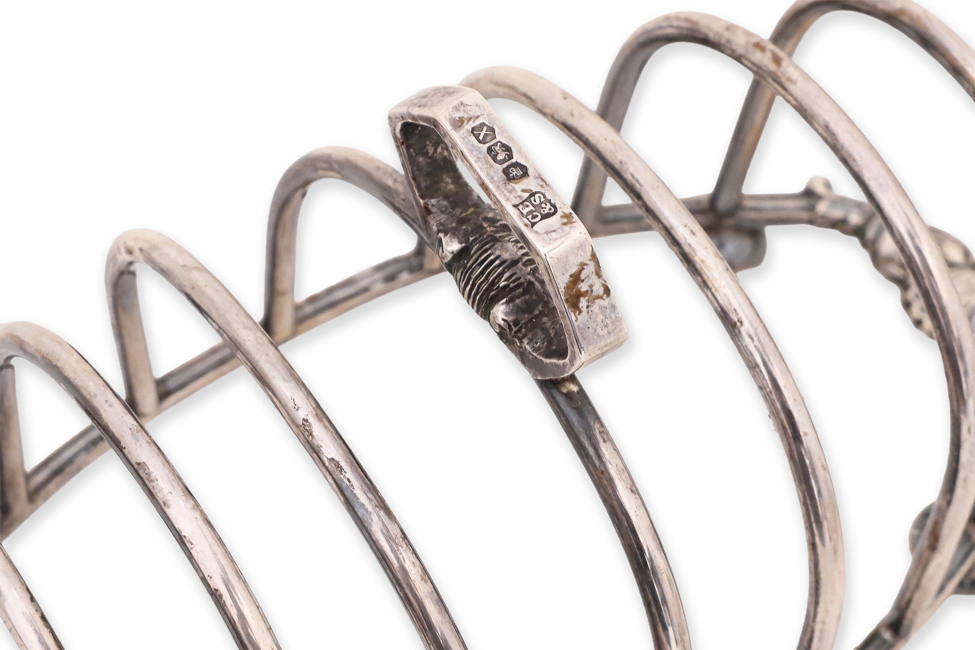 A PAIR OF ENGLISH STERLING SILVER TOAST RACKS