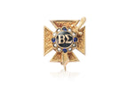 A GOLD SORORITY BADGE