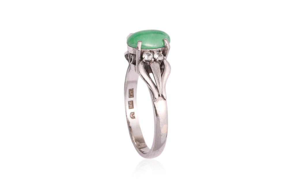 A JADEITE AND WHITE STONE RING