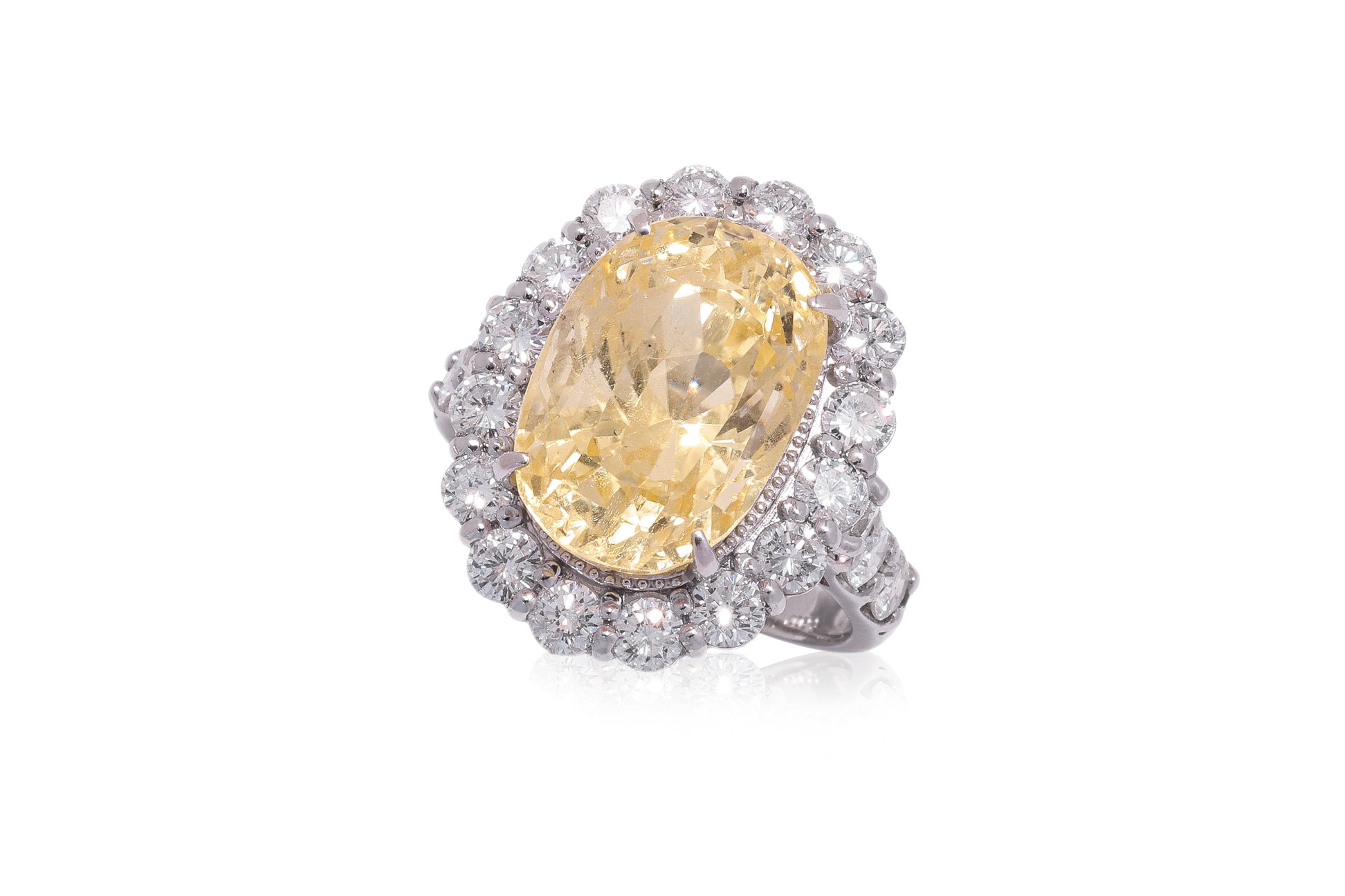 A LARGE UNHEATED YELLOW SAPPHIRE AND DIAMOND RING