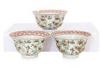 A GROUP OF FIVE FAMILLE ROSE 'MAGPIE' TEA BOWLS