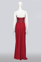SANDRA WEIL - A RED STRAPLESS DRESS WITH LEATHER BODICE