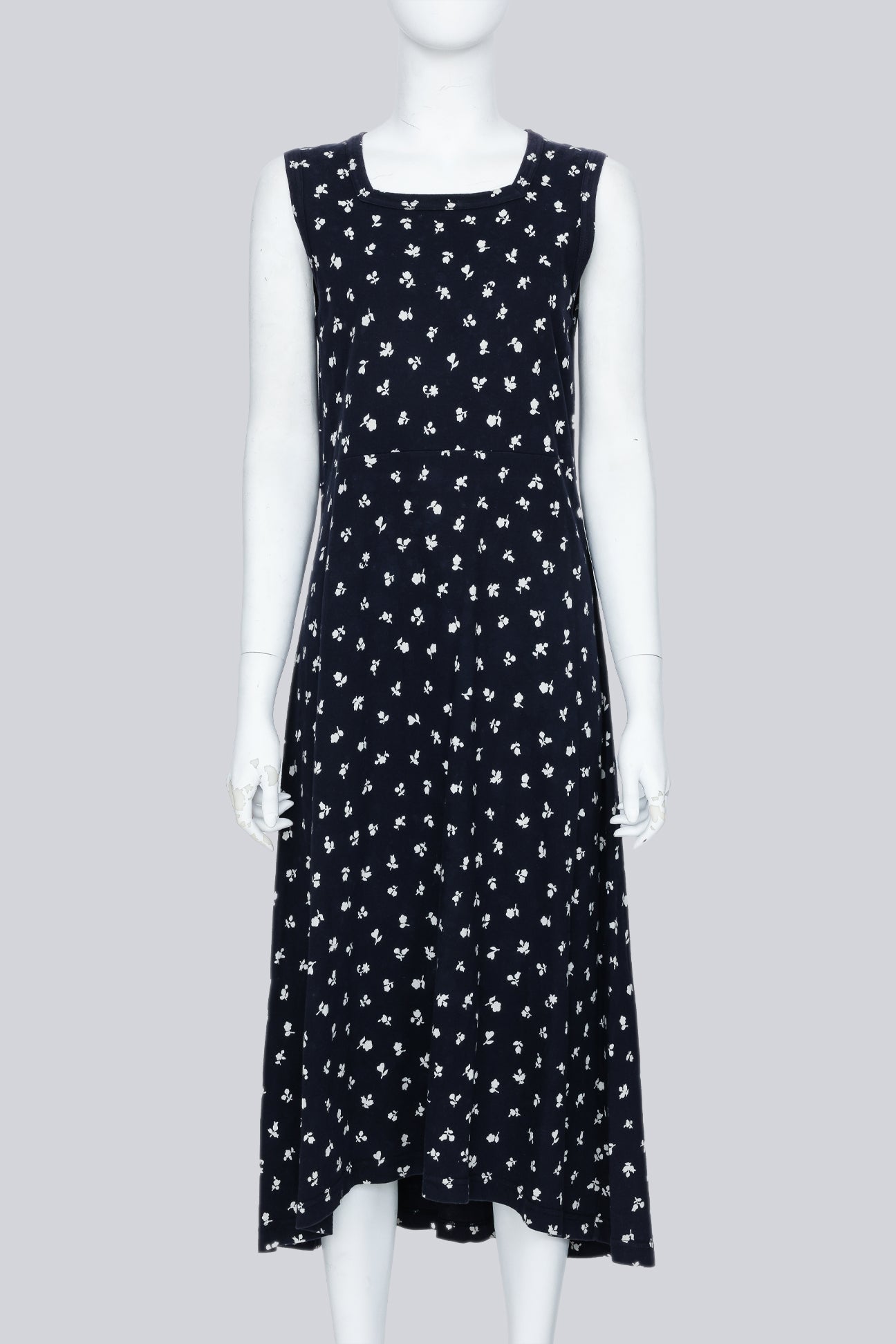 COMME DES GARCONS - A NAVY DRESS WITH A WHITE FLORAL PATTERN