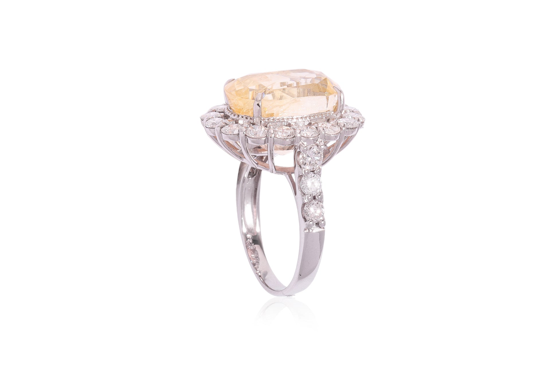 A LARGE UNHEATED YELLOW SAPPHIRE AND DIAMOND RING