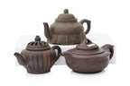 A GROUP OF SIX YIXING ZISHA POTTERY TEAPOTS