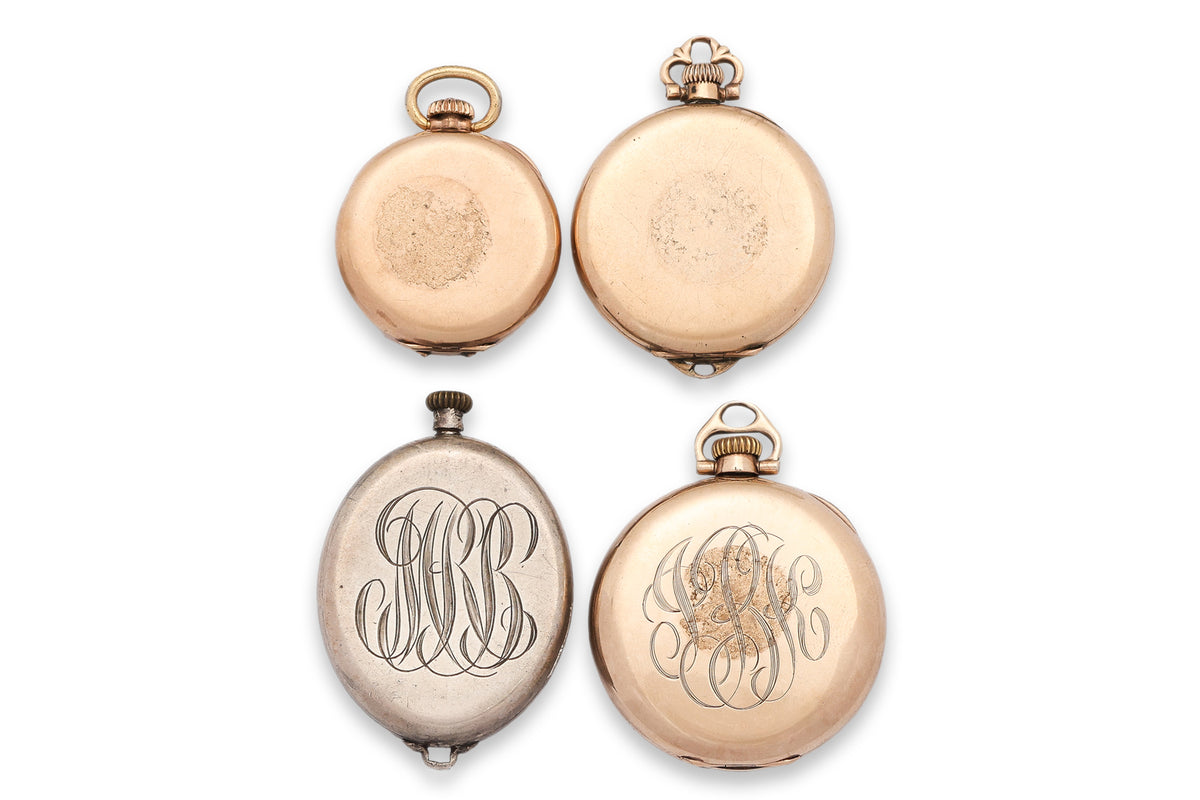 A GROUP OF FOUR PENDANT WATCHES