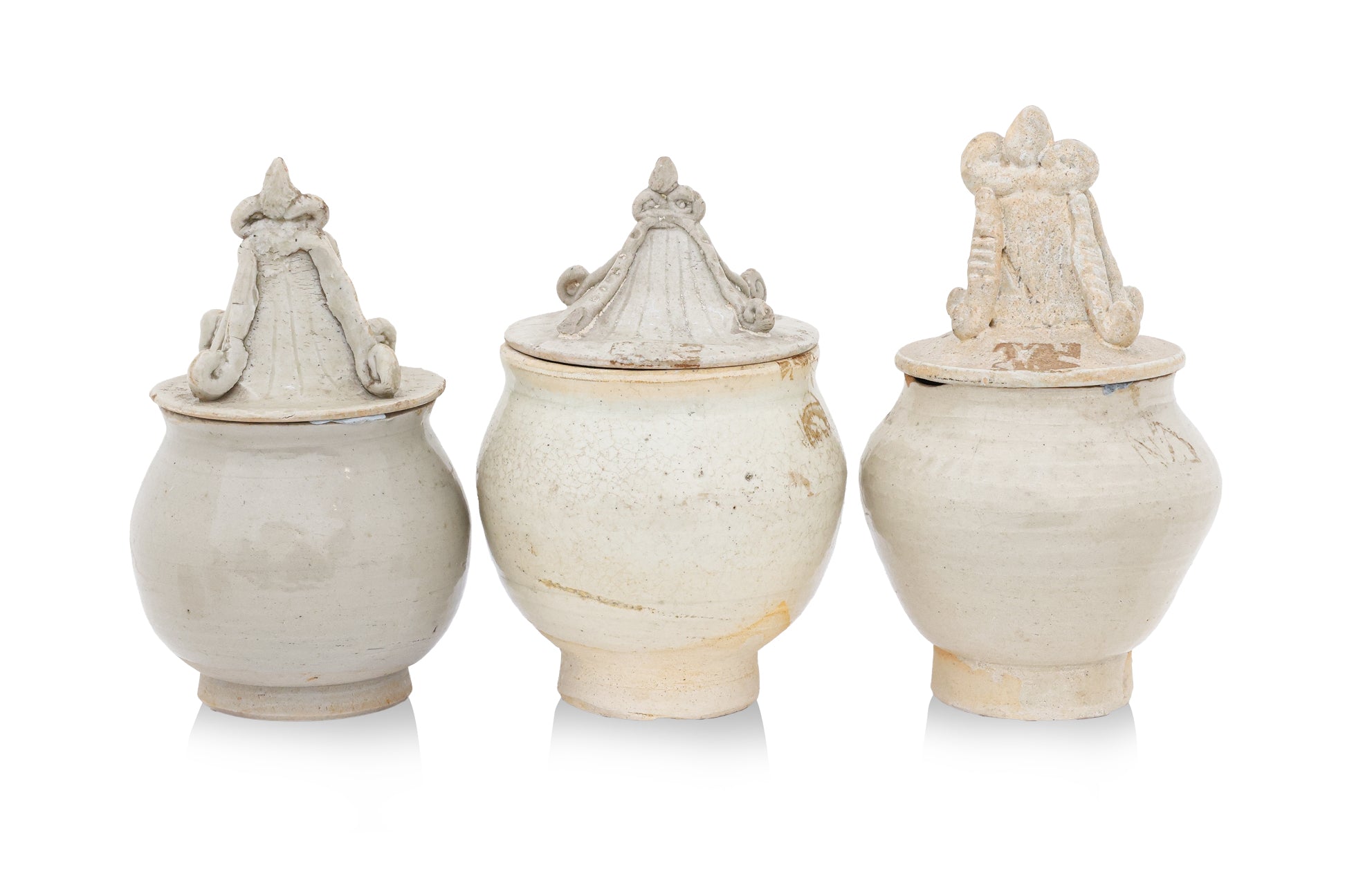 A GROUP OF QINGBAI-GLAZED JARS AND COVERS