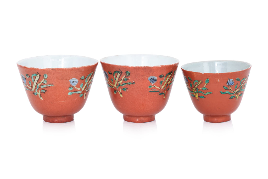 A GROUP OF 12 CORAL GROUND TEA BOWLS