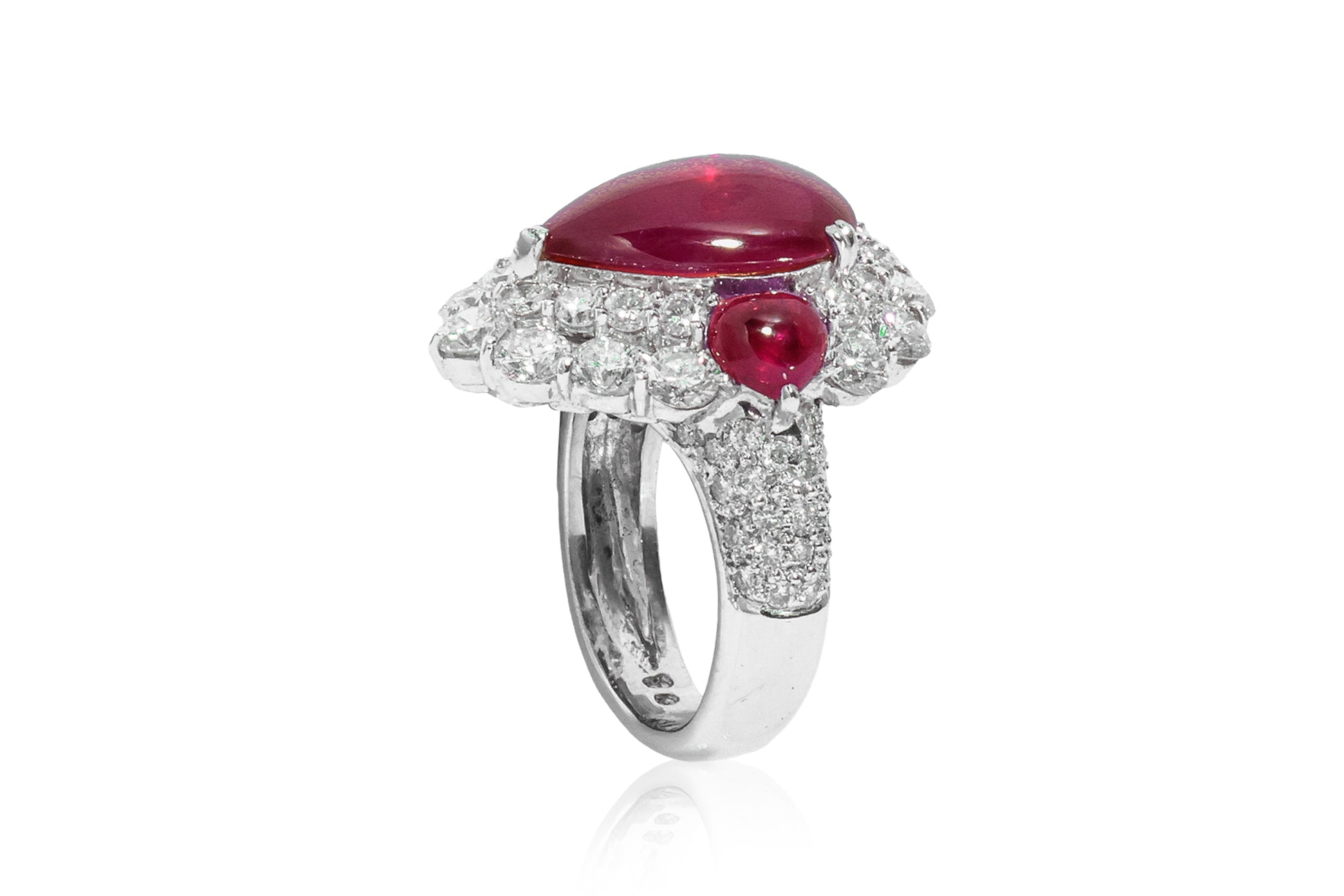 A LEAD GLASS FILLED RUBY AND DIAMOND RING