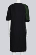 DRIES VAN NOTEN - A BLACK DRESS WITH SINGLE GREEN SLEEVE