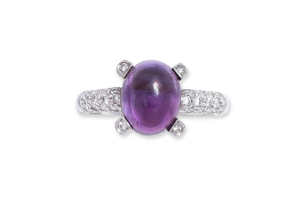 AN AMETHYST AND DIAMOND RING WITH MATCHING EARRINGS
