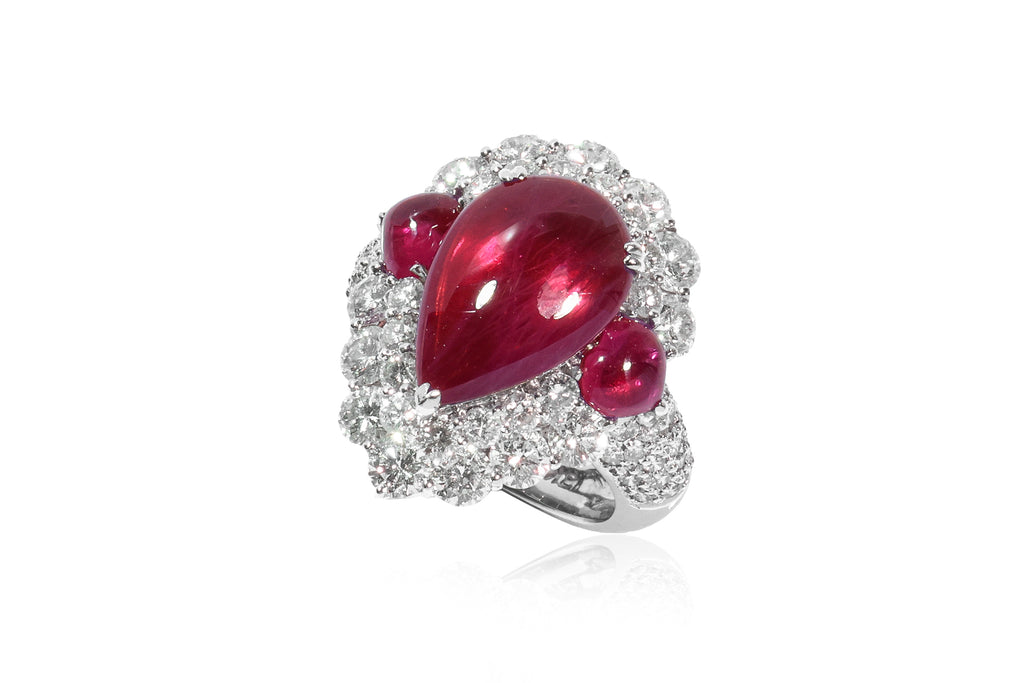 A LEAD GLASS FILLED RUBY AND DIAMOND RING