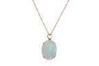 A LARGE OPAL PENDANT/BROOCH ON A CHAIN