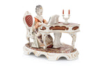 A GROUP OF FIVE GERMAN PORCELAIN FIGURES AND A CLOCK