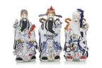 A SET OF THREE CHINESE PORCELAIN FU, LU, SHOU FIGURES