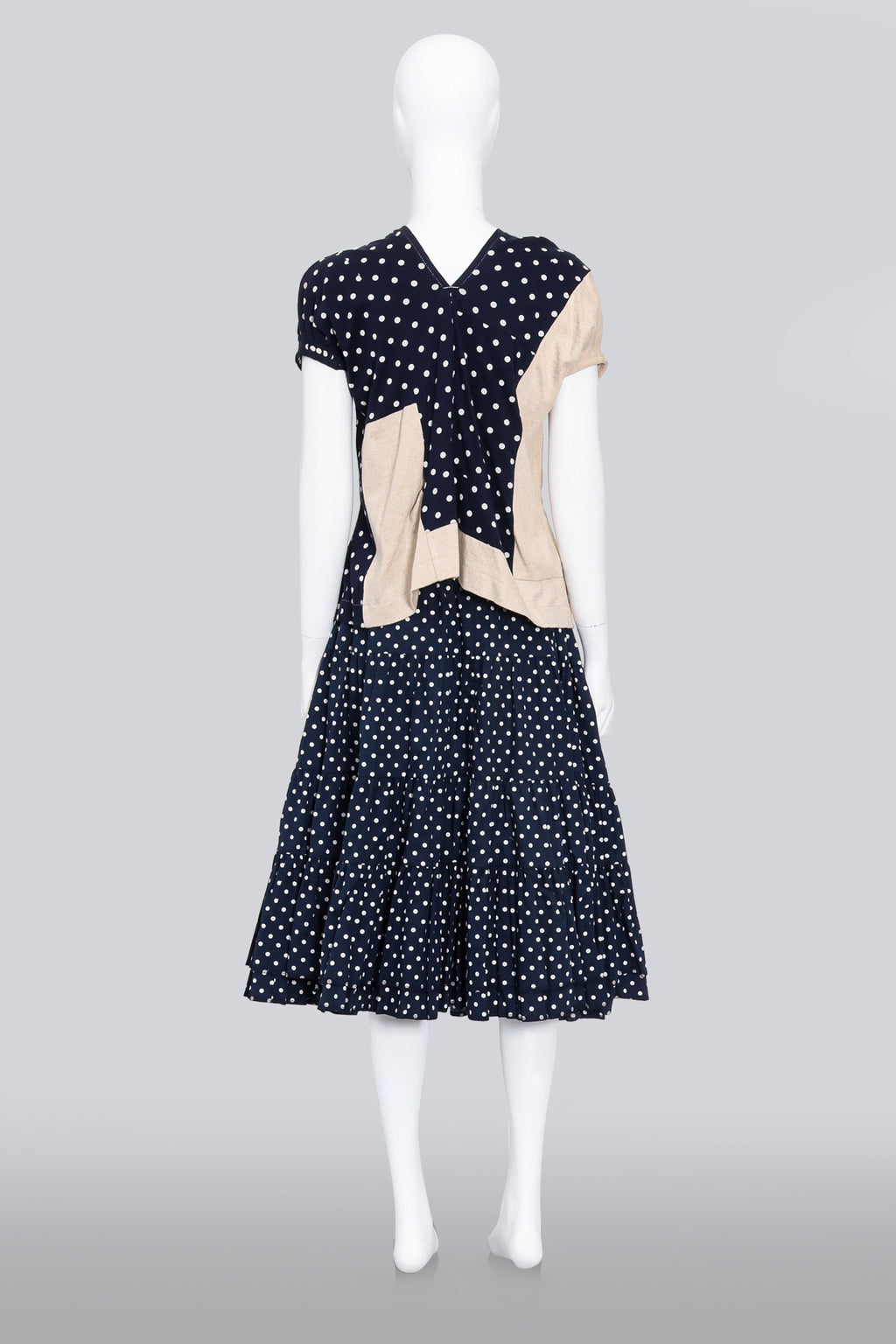 COMME DES GARCONS - A 2007 NAVY AND CREAM MULTI-PANEL POLKA DOT BLOUSE AND MATCHING SKIRT SET