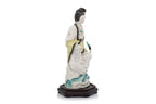 A POLYCHROME-ENAMELLED PORCELAIN FIGURE OF A WOMAN AND BIRD