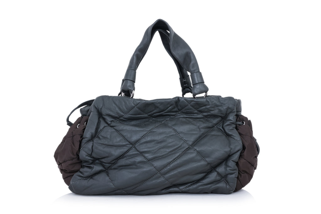 MONCLER - A QUILTED LEATHER BAG