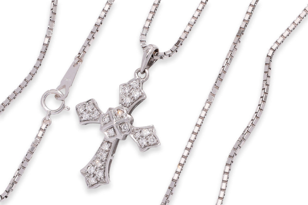 A DIAMOND 'CROSS' PENDANT ON CHAIN