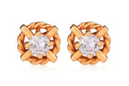 A PAIR OF HIGH KARAT GOLD DIAMOND STUD EARRINGS