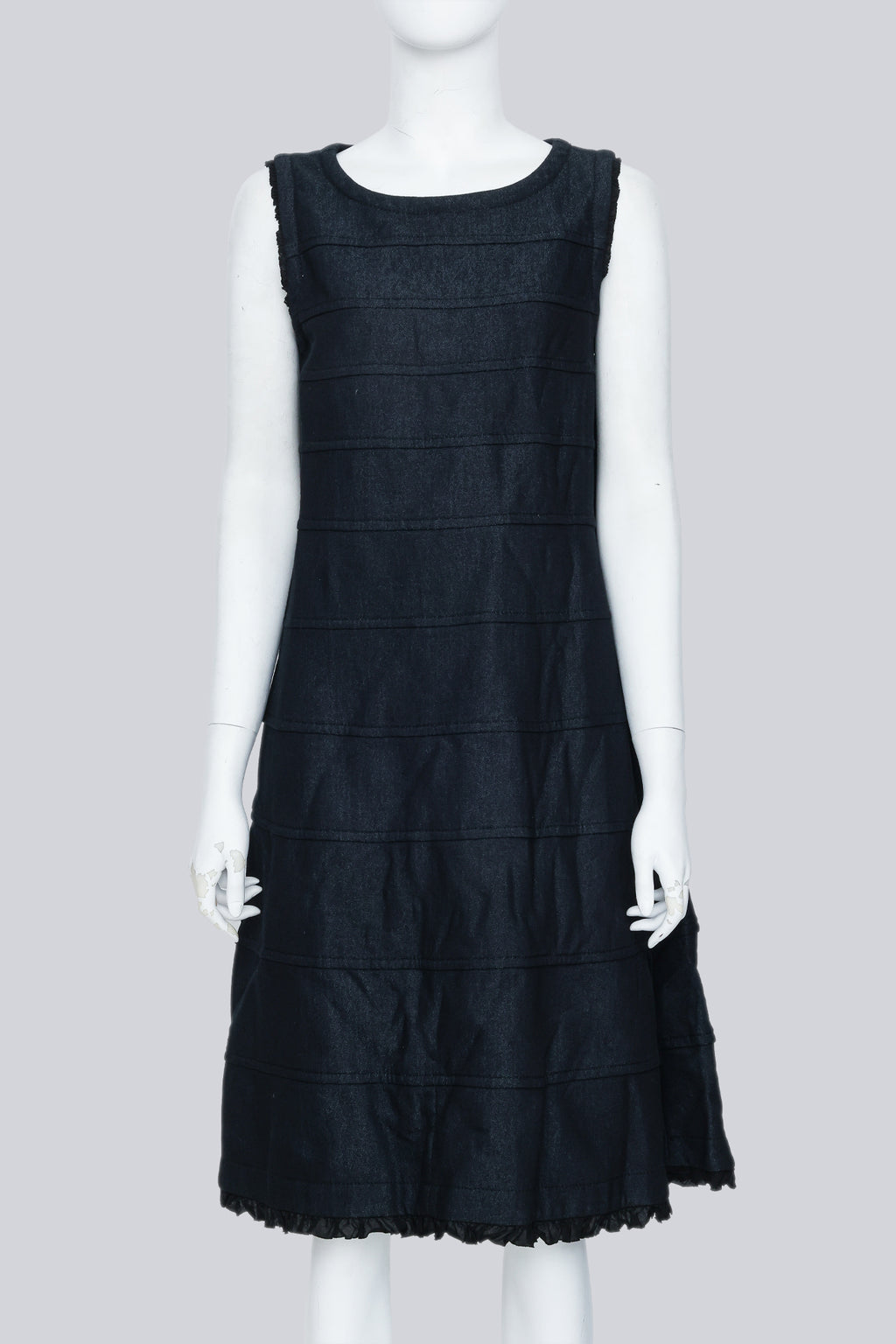 COMME DES GARÇONS TRICOT - A SLEEVELESS BLACK PANELLED DRESS WITH RUFFLED TRIM